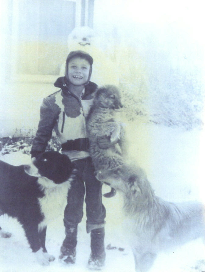 Francis at age 10 years old with dogs 
(Shep, Laddie,and Lassie). At maternal grandparents in Menan, Idaho.  